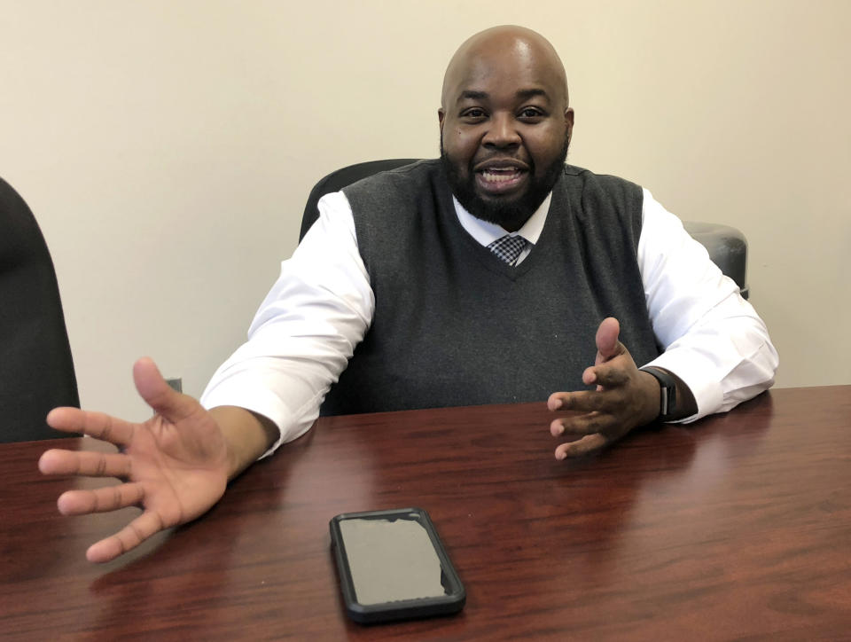 In this Thursday, April 18, 2019 photo Rodney Robinson, of Richmond, Va., gestures during an interview at the Virgie Binford Educational Center, a school inside the Richmond Juvenile Detention Center in Richmond, Va. Robinson was named Wednesday, April 24 as the 2019 National Teacher of the Year. He will spend the next year traveling around the country as an ambassador for education and an advocate for teachers and students. (AP Photo/Denise Levoie)