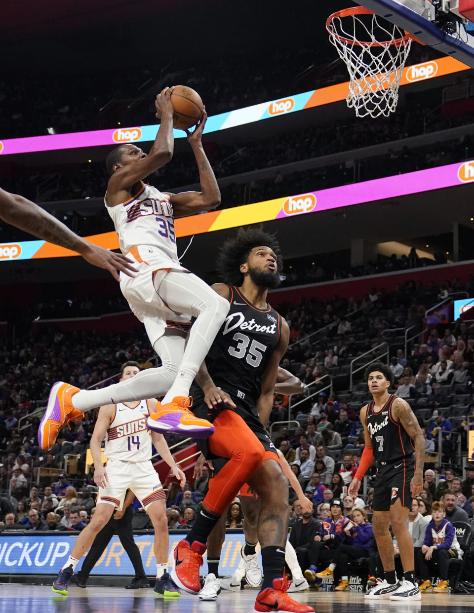 Phoenix Suns forward Kevin Durant (35) attempts a basket as Detroit Pistons forward Marvin Bagley III (35) defends during the second half of an NBA basketball game, Sunday, Nov. 5, 2023, in Detroit. (AP Photo/Carlos Osorio)