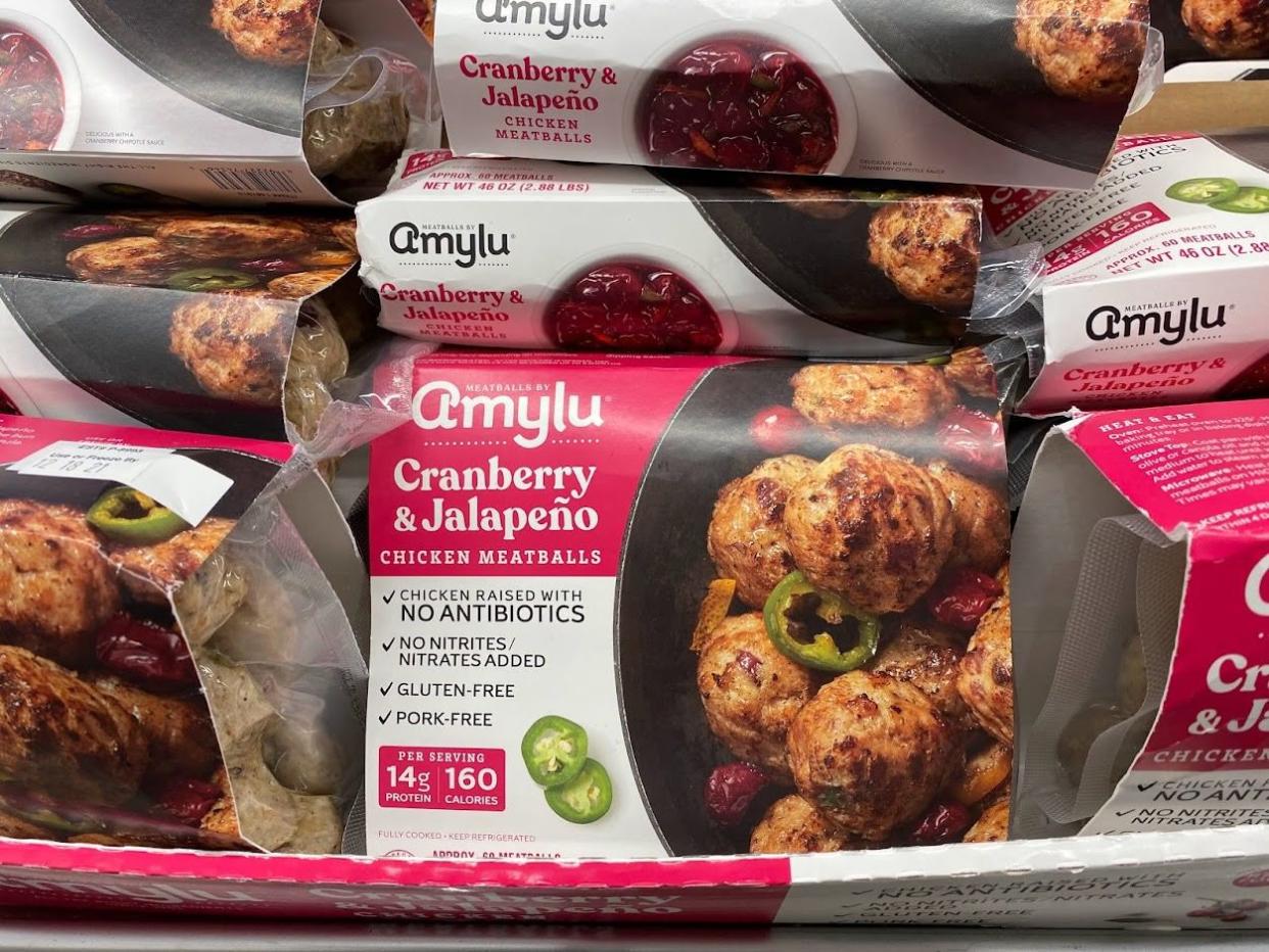 Packages of Cranberry and Jalapeno Chicken Meatballs piled on top of each other at Costco.