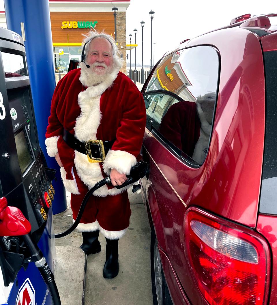 Santa was filling up his red van over the weekend.  Probably heading back to the North Pole for his long night Christmas Eve.