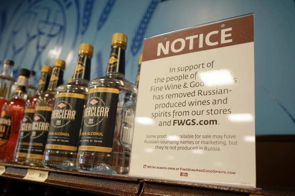 A sign at a liquor store reads: In support of the people of Ukraine, Fine Wine & Good Spirits has removed Russian-produced wines and spirits from our stores.