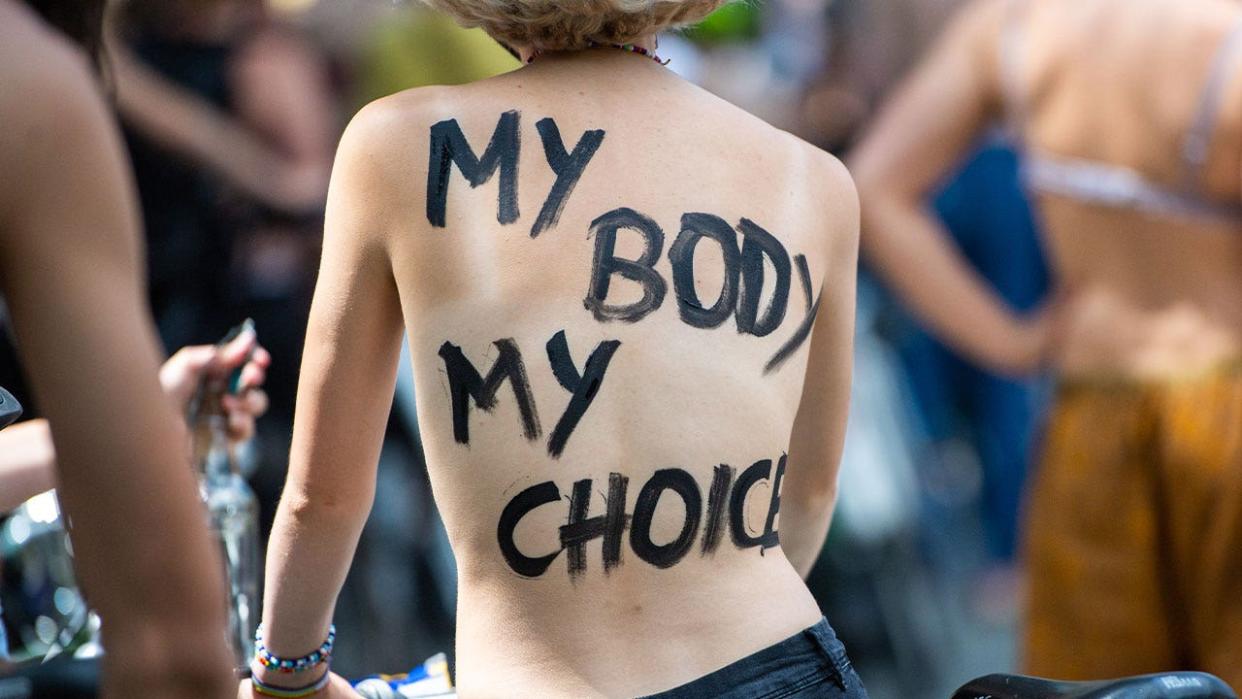 <div>A participant of a Berlin bicycle demonstration under the motto "No Nipple is free until all Nipples are free!" has the words My Body My Choice written on her back.</div> <strong>(Christophe Gateau/picture alliance)</strong>