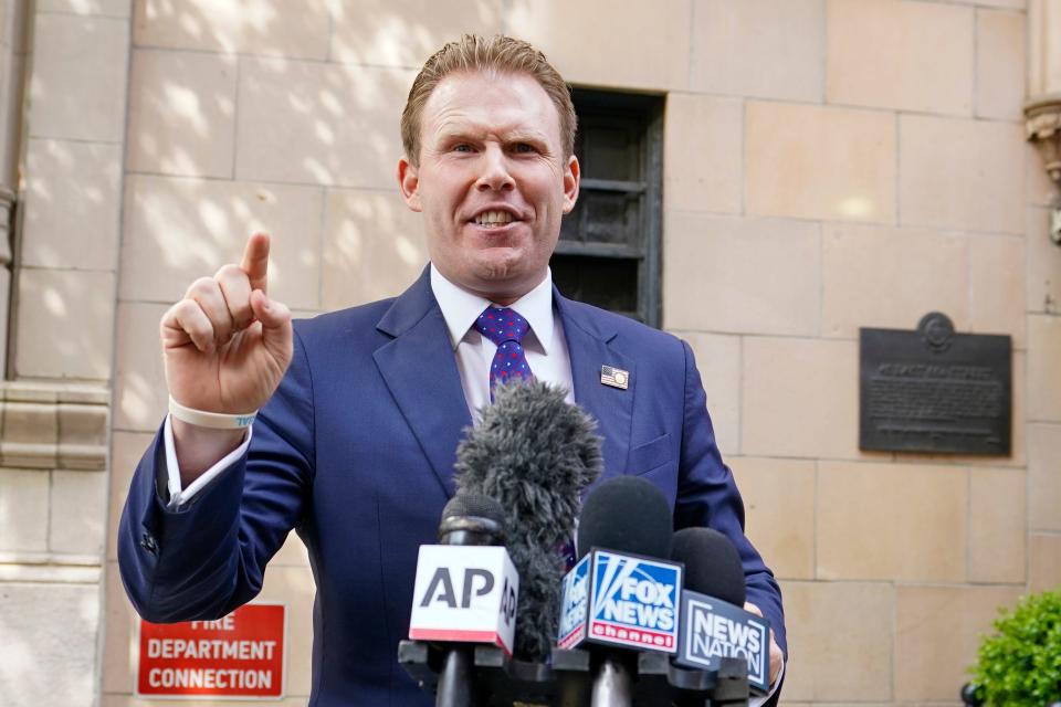 Andrew Giuliani, son of former New York Mayor Rudy Giuliani, speaks to reporters outside the building where his father lives, Wednesday, April 28, 2021, in New York. Federal agents raided Rudy Giuliani's Manhattan home and office on Wednesday, seizing computers and cellphones in a major escalation of the Justice Department's investigation into the business dealings of former President Donald Trump's personal lawyer. (AP Photo/Mary Altaffer)