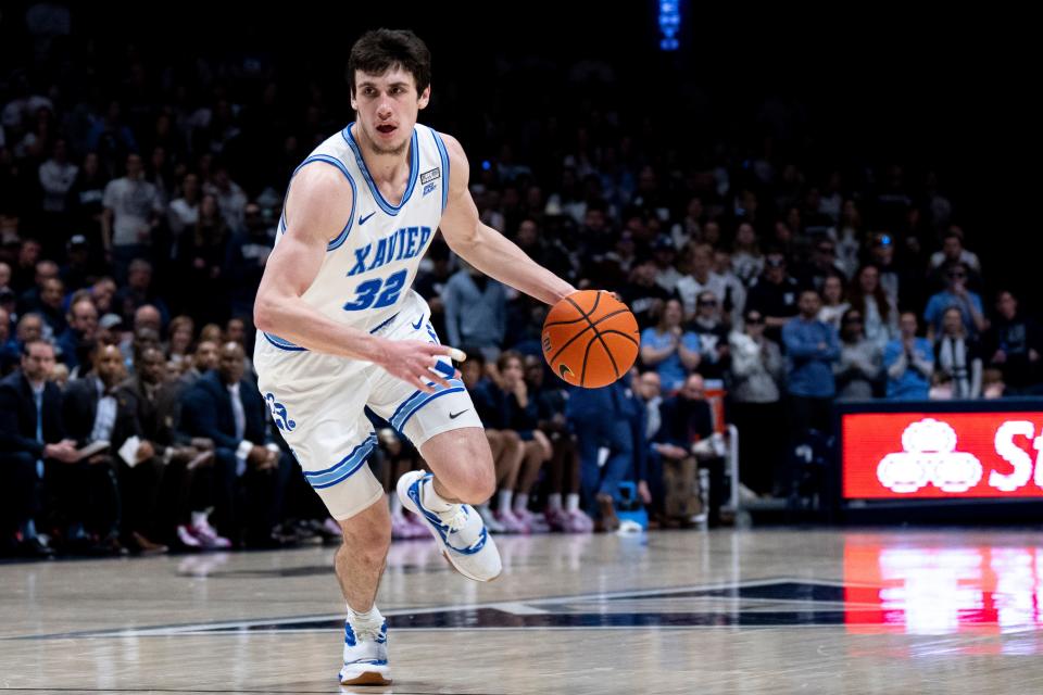 Xavier Musketeers forward Zach Freemantle (32) handles the ball in the second half of the NCAA men’s basketball game at the Cintas Center in Cincinnati on Saturday, Jan. 21, 2023. Xavier Musketeers defeated Georgetown Hoyas 95-82. 