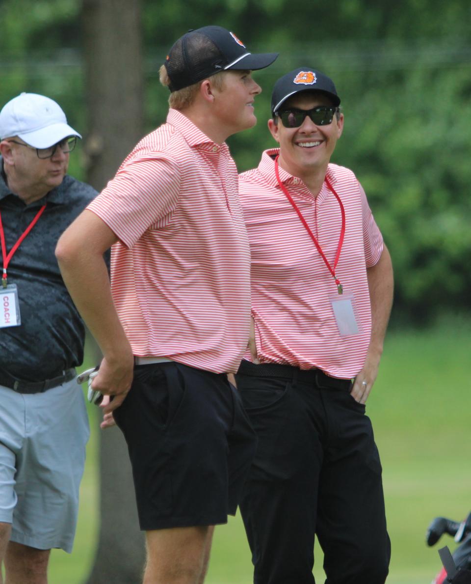 Brighton senior Matt Doyle chats with coach James Dewling before hitting a tee shot during the Division 1 golf regional Wednesday, May 31, 2023 at Salem Hills Golf Club.