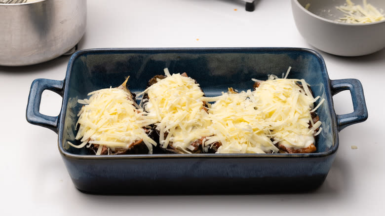 cheese stuffed eggplant in baking dish