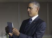<p>President Barack Obama uses an iPad as he tours the DreamPlex Coworking Space in Ho Chi Minh City, Vietnam, Tuesday, May 24, 2016. (AP Photo/Carolyn Kaster) </p>