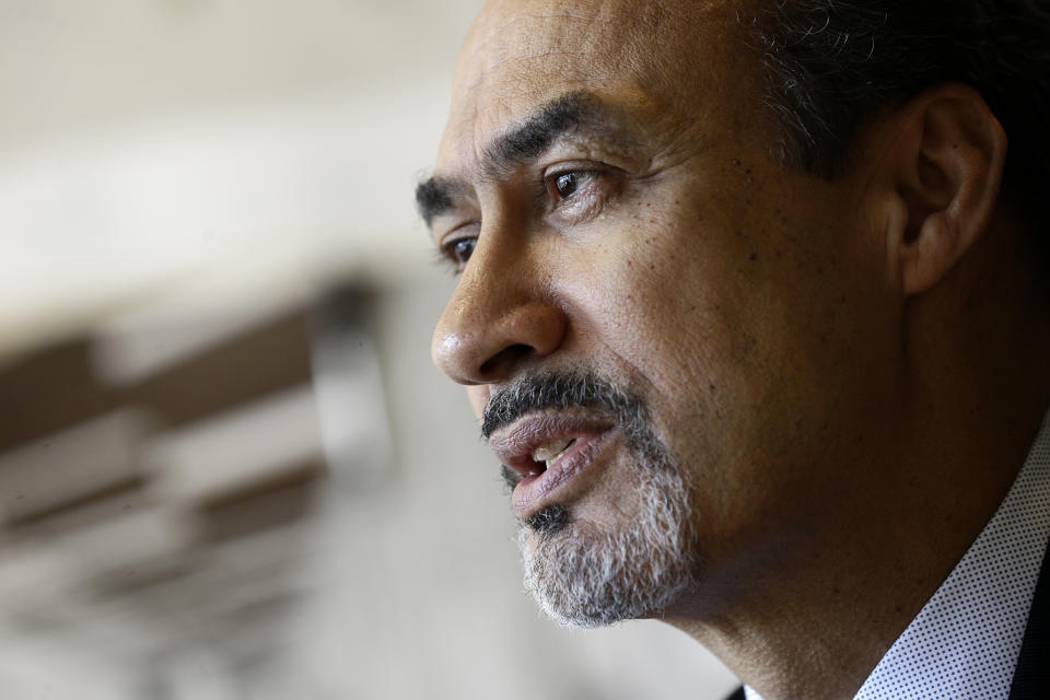 FILE - In this Jan. 18, 2017, file photo, architect Phil Freelon responds to a question during an interview at his office in Durham, N.C. Freelon, the architect of the National Museum of African American History and Culture and other libraries, museums and schools, died Tuesday, July 9, 2019. Freelon was 66 years old and had suffered from ALS for several years. (AP Photo/Gerry Broome, File)