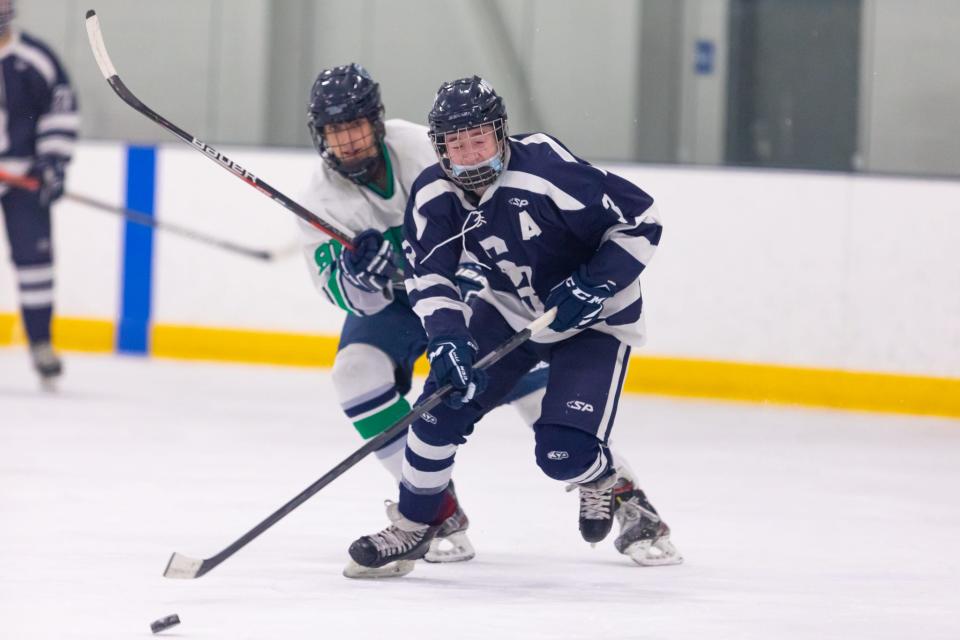 Somerset Berkley’s Davis Sullivan moves the puck through the neutral zone against Dighton-Rehoboth/Seekonk.