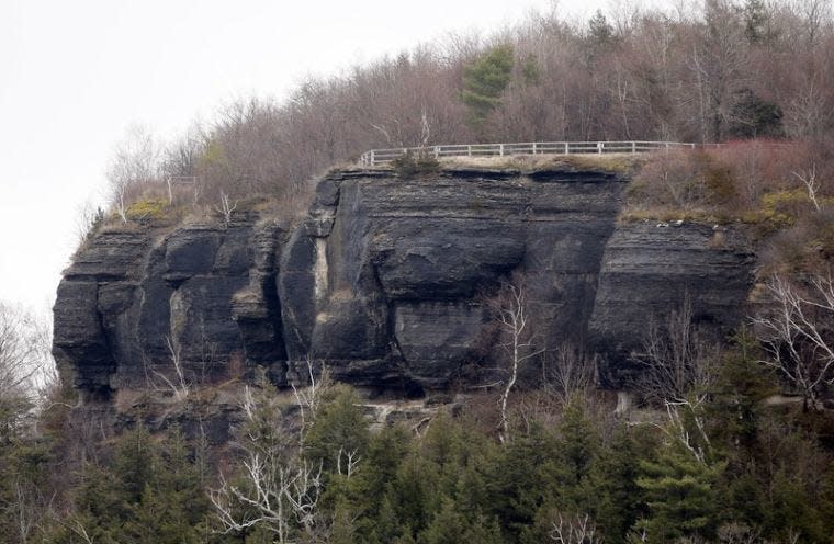 A cliff face is seen at John Boyd Thacher State Park on Thursday, Dec. 5, 2013, in Guilderland, N.Y. The park, which sprawls along a cliff southwest of Albany, plans to let the rock climbers and spelunkers come, the latest outdoor adventures in a park system that already hosts everything from 100-kilometer runs to windsurfing in the Atlantic. (AP Photo/Mike Groll)