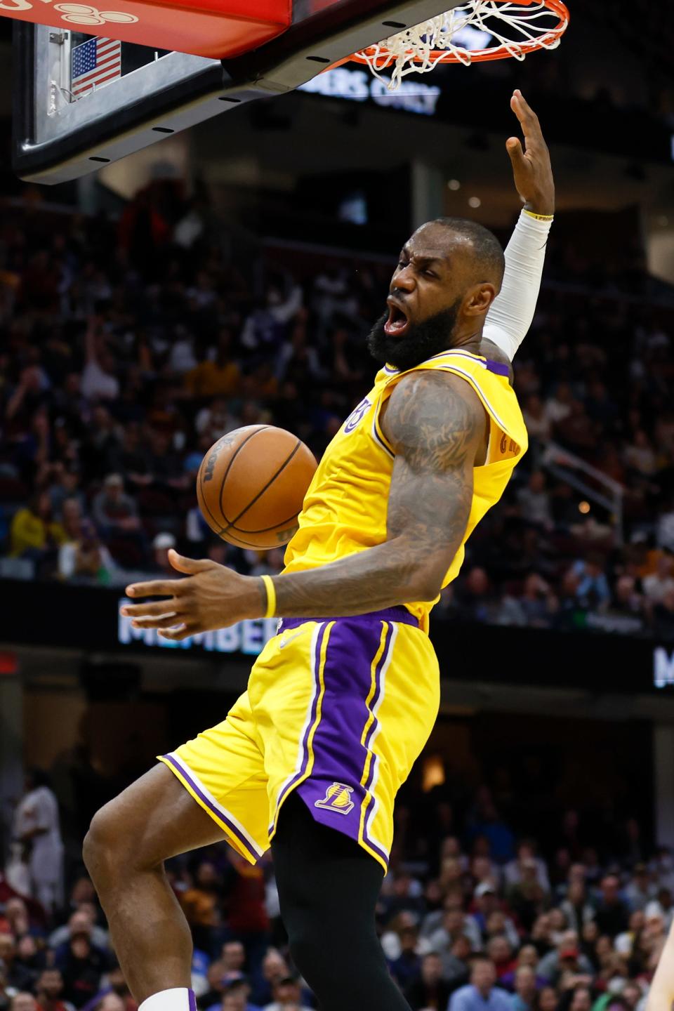 Los Angeles Lakers' LeBron James dunks against the Cleveland Cavaliers during the second half of an NBA basketball game, Monday, March 21, 2022, in Cleveland. (AP Photo/Ron Schwane)