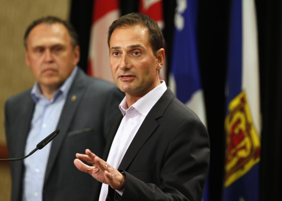 Robert Ghiz, premier of Prince Edward Island (R) during a news conference on August 28, 2014. (Reuters)