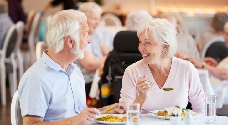 Couple enjoys a meal at an one of the best active retirement communities