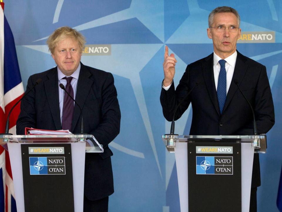 Johnson and Nato Secretary General Jens Stoltenberg in Brussels on 19 March (AP)