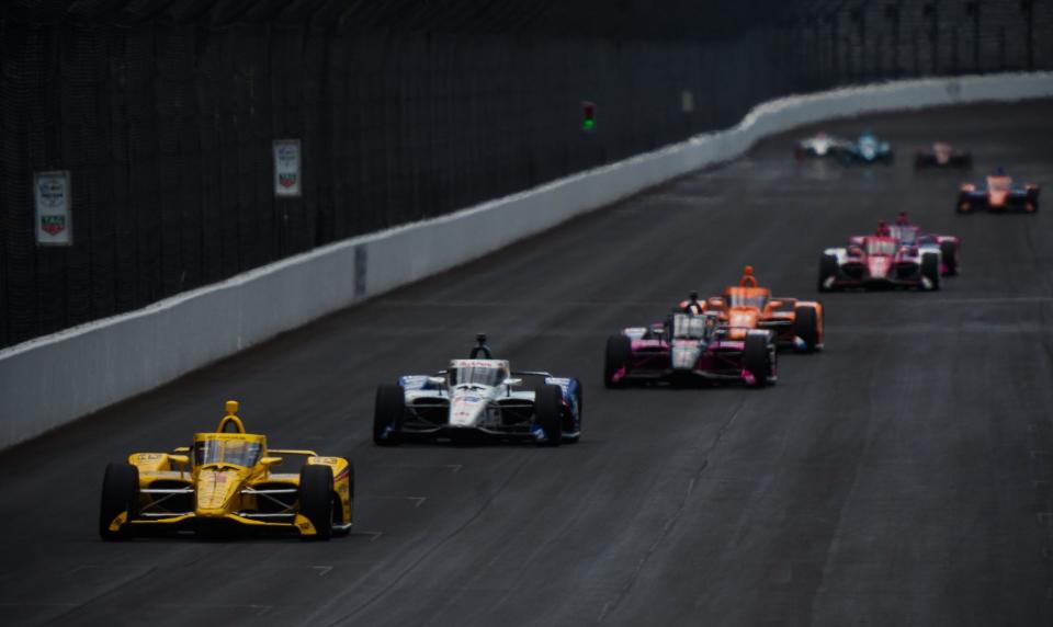 Team Penske driver Scott McLaughlin (3) leads a pack of cars down the front stretch Tuesday, May 17, 2022, during the first practice session in preparation for the 106th running of the Indianapolis 500 at Indianapolis Motor Speedway.