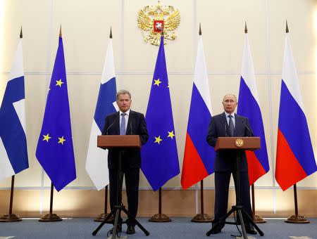 Finnish President Sauli Niinisto and Russian President Vladimir Putin attend a joint news conference following their meeting at the Bocharov Ruchei state residence in the Black Sea resort of Sochi, Russia August 22, 2018. Pavel Golovkin/Pool via REUTERS