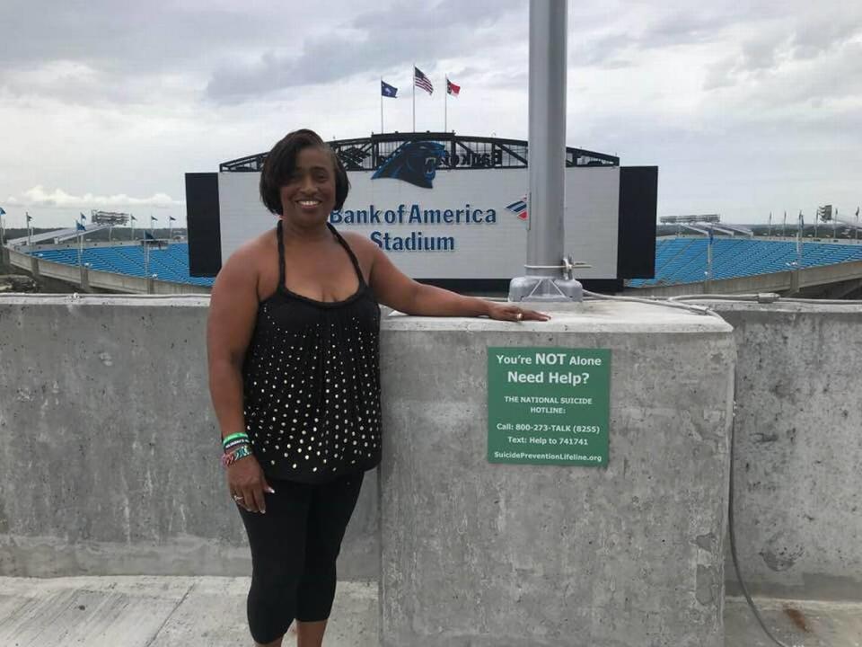 Fonda Bryant has helped save lives with her efforts to get signs put in parking decks throughout uptown with contact information for the National Suicide Prevention Lifeline (1-800-273-8255).