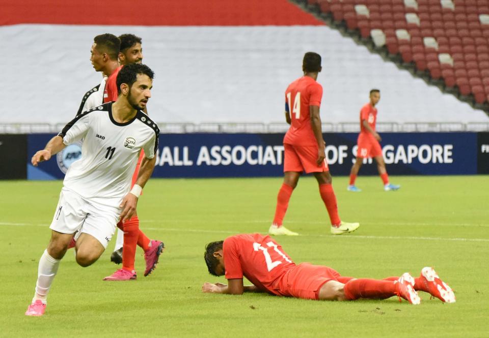 Yemen's Abdulwasea Al-Matari (left) wheels away in celebration after scoring their first goal against Singapore in their 2022 World Cup qualifying match at National Stadium. (PHOTO: Zainal Yahya/Yahoo News Singapore)