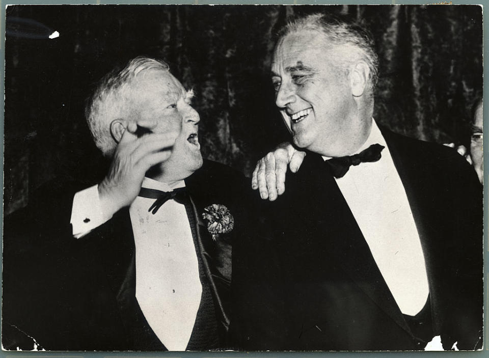 John Nance Garner (left) greets President Franklin Delano Roosevelt as he arrived at a Democratic party dinner.<span class="copyright">George Rinhart/Corbis ––Getty Images</span>