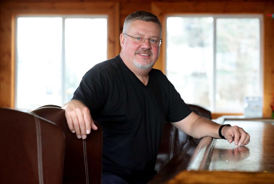 Portage Lakes businessman Tim Adkins, who purchased the Turkeyfoot Lake Golf Links property, his largest business purchase to date, poses for a portrait in his restaurant, The Basement Bar & Grill in Cuyahoga Falls, Jan. 17.