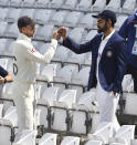 England captain Joe Root, left, and India captain Virat Kohli meet prior to the first Test Match between England and India at Trent Bridge cricket ground in Nottingham, England, Monday, Aug. 2, 2021. (AP Photo/Rui Vieira)