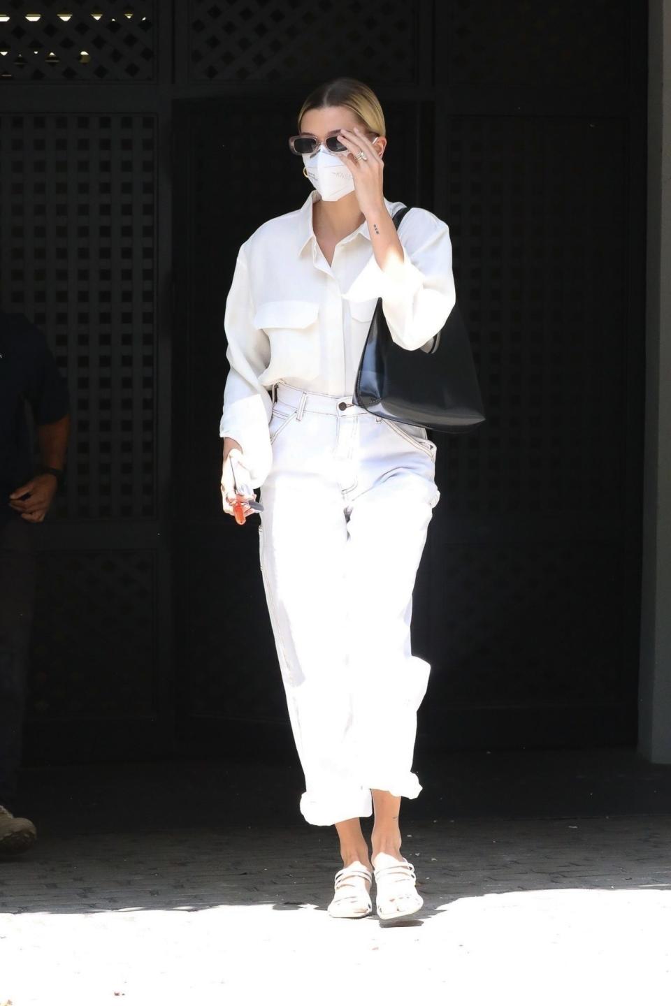 <p>Hailey Baldwin keeps covered up on Thursday while leaving a business meeting in L.A. </p>