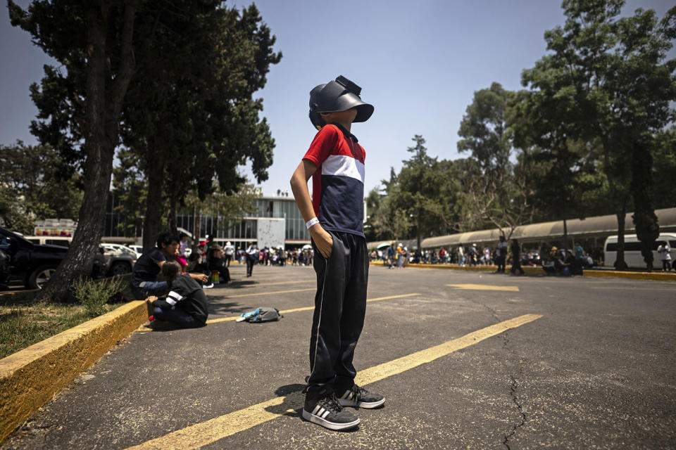 Image: A boy looks through a welders mask at the total eclipse in Mexico City. (Carl de Souza / AFP via Getty Images)