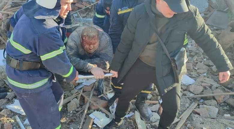 Rescuers pull a man out of a pile of debris after Russian airstrikes hit civilian areas of Mykolaiv, Ukraine, March 13, 2022. / Credit: State Emergency Service of Ukraine/Handout/Anadolu Agency/Getty