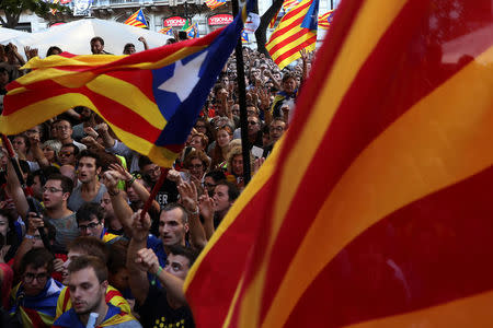 Protestors gather outside the Catalan region's economy ministry building during a raid by Spanish police on government offices, in Barcelona, Spain, September 20, 2017. REUTERS/Susana Vera