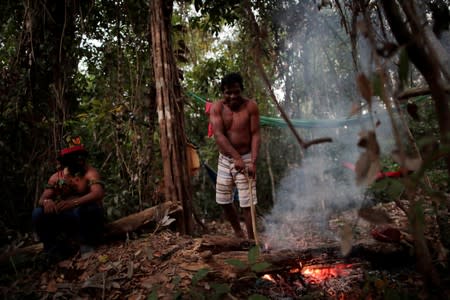 The Wider Image: Fighting fire with fire, Amazon 'forest guardians' stalk loggers