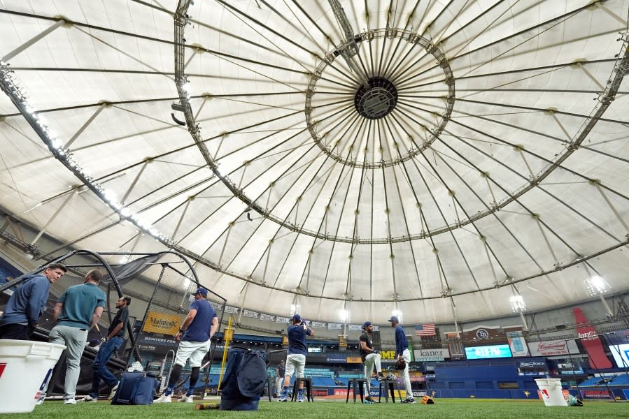 Tampa Bay Rays players take batting practice before a baseball game between the Rays and the Detroit Tigers Wednesday, April 24, 2024, at Tropicana Field in St. Petersburg, Fla. The future of the Tampa Bay Rays should come into clear focus in the coming weeks as the St. Petersburg City Council begins discussions about the $1.3 billion ballpark that would open for the 2028 baseball season. The stadium is the linchpin of a much larger project that would transform the downtown with affordable housing, a Black history museum, office and retail space. (AP Photo/Chris O’Meara)