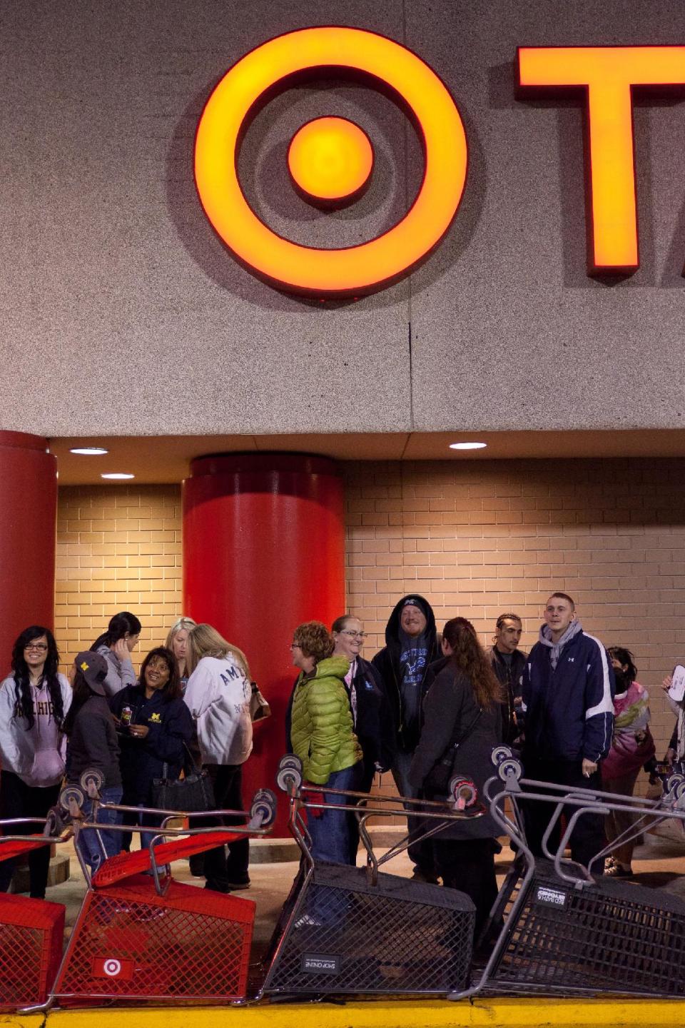 Shoppers wait in line outside of Target prior to them opening Thursday Nov. 22, 2012 at 9 p.m. for their Black Friday sales event in Flint, Mich. (AP Photo/Flint Journal, Griffin Moores)