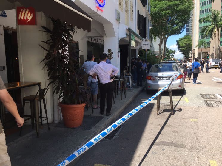 Police respond to an incident at Boon Tat street on Monday (10 July). (Photo: Gabriel Choo/ Yahoo Singapore)