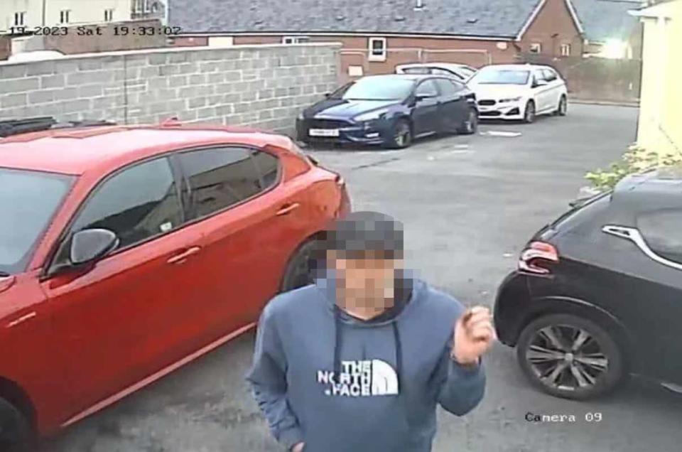 The man wore a blue North Face hoodie and navy baseball cap and was seen making two trips to the car with a holdall. (Wales News)