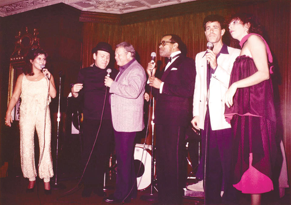 The Manhattan Transfer perform with Mel Tormé (third from left) and Jon Hendricks at the Playboy Mansion in 1982.