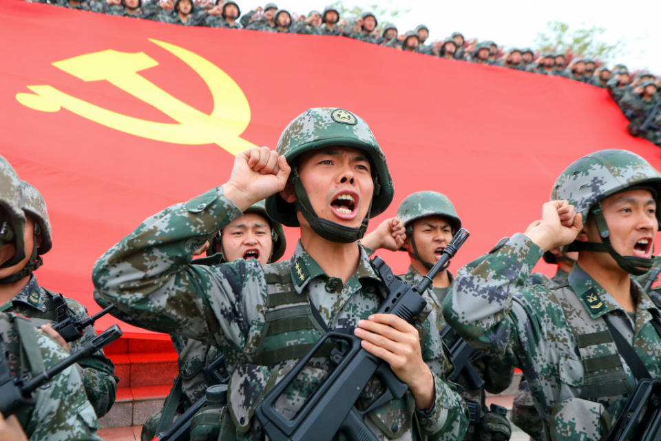 Soldiers seen in front of the flag of the Communist Party of China at an official event on April 13, 2021 in Luoyang, Henan Province, China.<span class="copyright">Jia Fangwen/VCG via Getty Images</span>