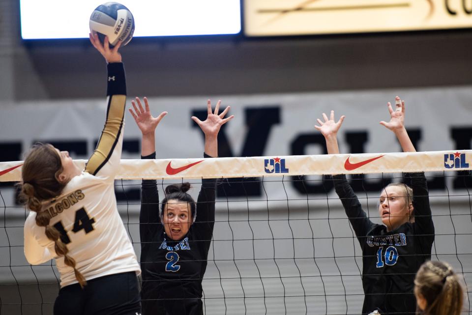 Gunter's Shae Pruiett (2) and Hanna Rubis attempt to block Bushland's Abby Howell in the Class 3A state championship match at the Curtis Culwell Center in Garland.
