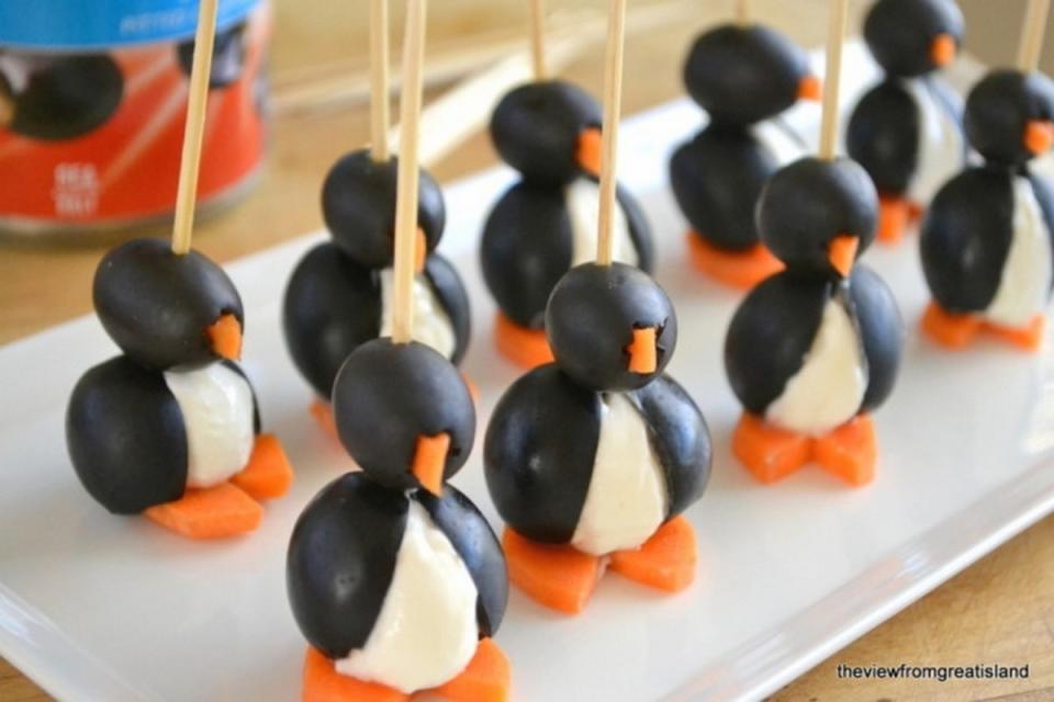 <p>The View From Great Island</p><p>Little penguins made with two sizes of black olives, cream cheese and a carrot.</p><p><strong>Get the recipe: <a href="https://theviewfromgreatisland.com/its-5-oclock-somewhere-friday-party-animals/" rel="nofollow noopener" target="_blank" data-ylk="slk:Olive Penguins;elm:context_link;itc:0;sec:content-canvas" class="link ">Olive Penguins</a></strong></p>