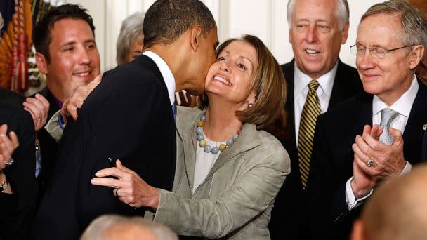 PHOTO: President Barack Obama kisses Speaker of the House Nancy Pelosi after signing the Affordable Health Care for America Act during a ceremony in the East Room of the White House, March 23, 2010. (Chip Somodevilla/Getty Images, FILE)