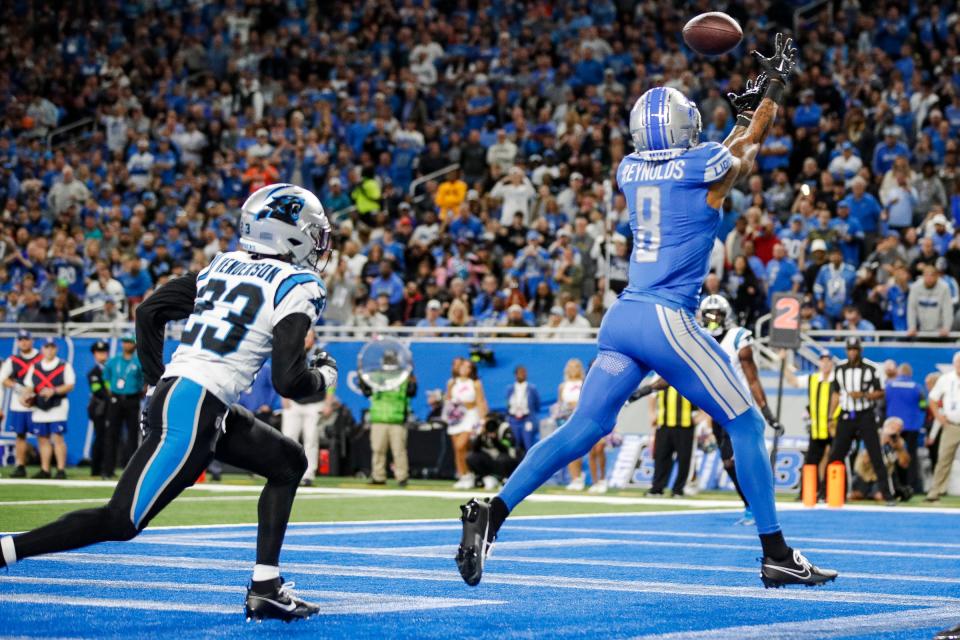 Lions wide receiver Josh Reynolds makes catch for a touchdown against Panthers cornerback CJ Henderson during the first half on Sunday, Oct. 8, 2023, at Ford Field.