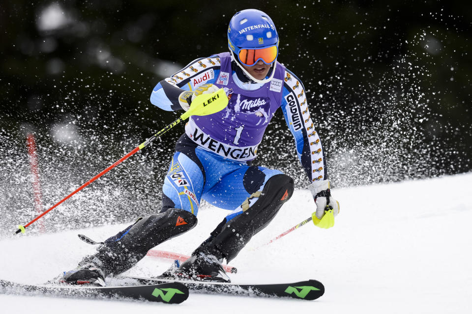 Andre Myhrer of Sweden clears a gate during the first run of the men's Alpine skiing slalom World Cup race at the Lauberhorn in Wengen, Switzerland, Sunday, Jan. 19, 2014. (AP Photo/Keystone, Jean-Christophe Bott)