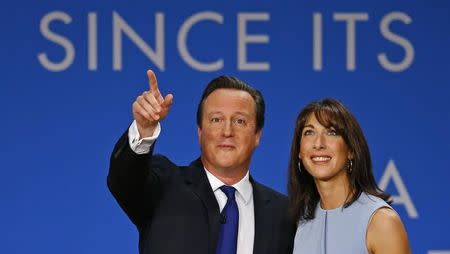Britain's Prime Minister David Cameron stands with his wife Samantha after delivering his keynote address to the Conservative Party Conference in Birmingham, central England October 1, 2014. REUTERS/Darren Staples