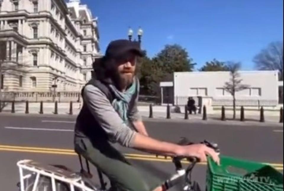 The People’s Convoy trucker protest was reduced to a slow crawl in Washington DC by one man on a bike (Twitter/WYSIWYGTV)