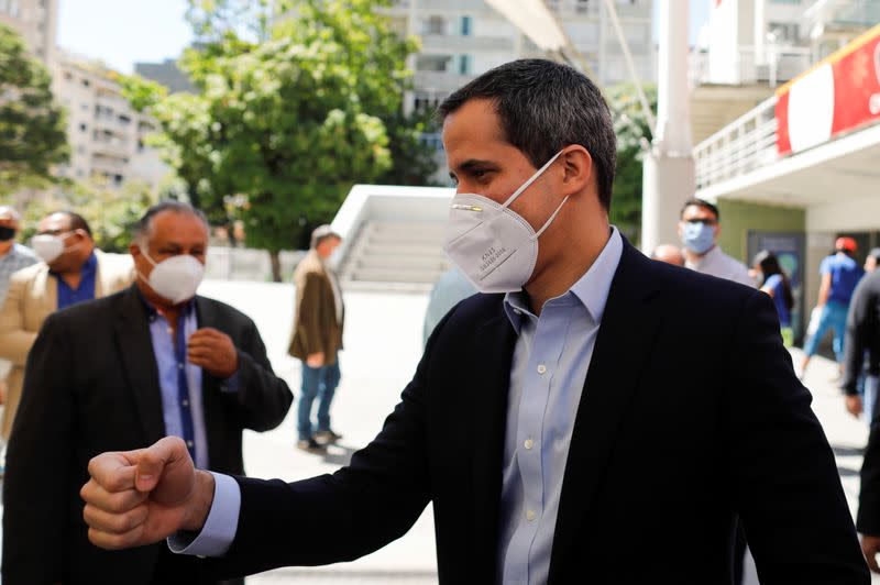 Venezuelan opposition leader Juan Guaido arrives to a news conference in Caracas