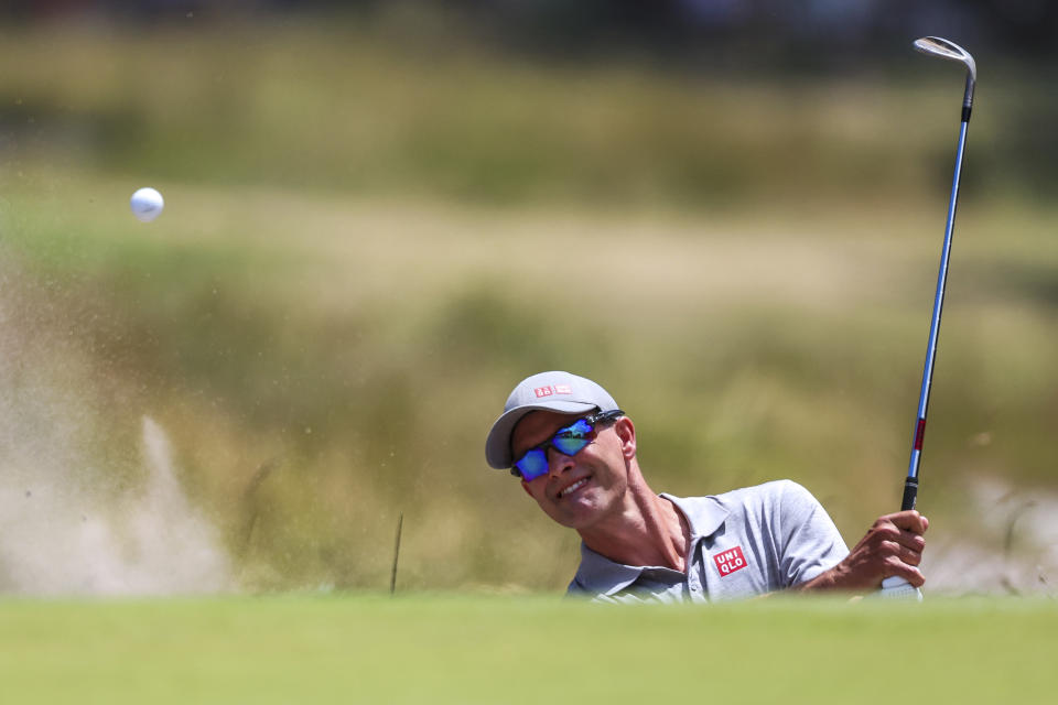 Australia's Adam Scott plays out of the bunker on the first hole during the Australian Open golf championship at Victoria golf course in Melbourne, Australia, Saturday, Dec. 3, 2022. (AP Photo/Asanka Brendon Ratnayake)