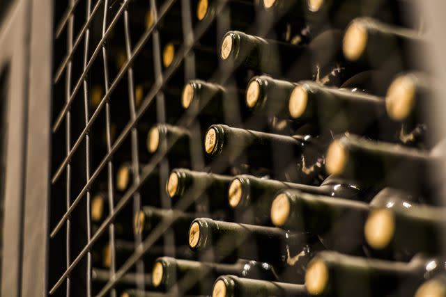 <p> Getty Images / Tim Martin </p> Wine bottles on a shelf