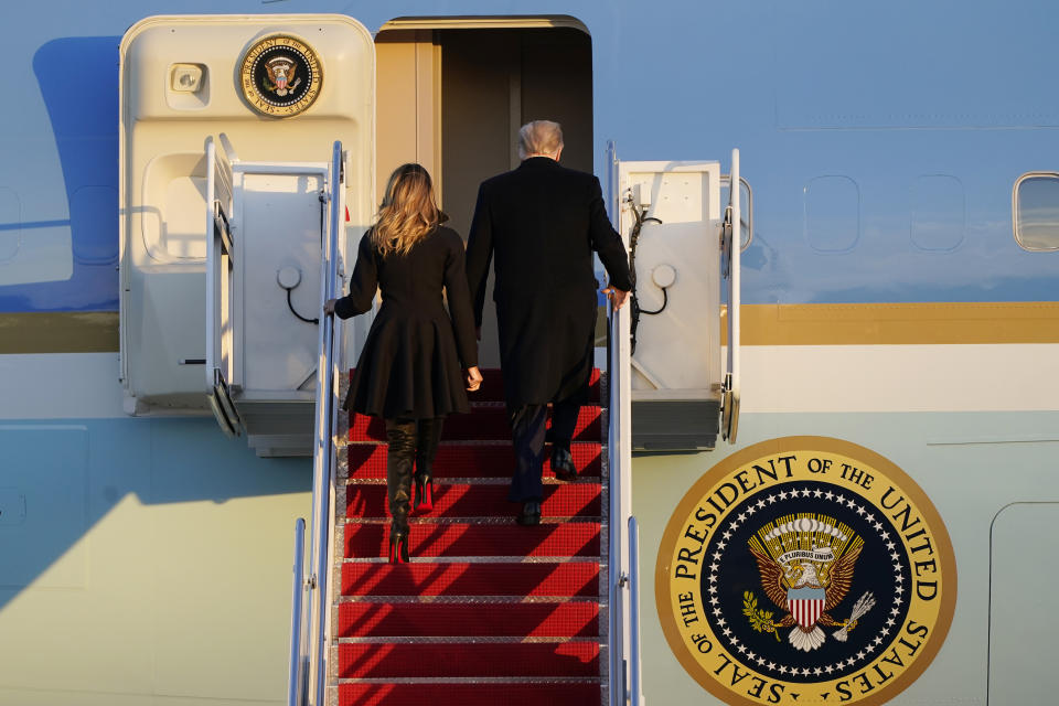 President Donald Trump and first lady Melania Trump, board Air Force One at Andrews Air Force Base, Md., Wednesday, Dec. 23, 2020. Trump is traveling to his Mar-a-Lago resort in Palm Beach, Fla. (AP Photo/Jacquelyn Martin)