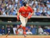 Mar 25, 2019; Mesa, AZ, USA; Boston Red Sox left fielder Andrew Benintendi (16) runs to first after hitting a home run against the Chicago Cubs during the third inning at Sloan Park. Mandatory Credit: Joe Camporeale-USA TODAY Sports