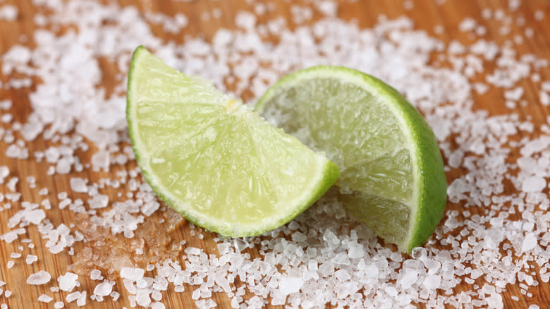 Limes with salt on wood