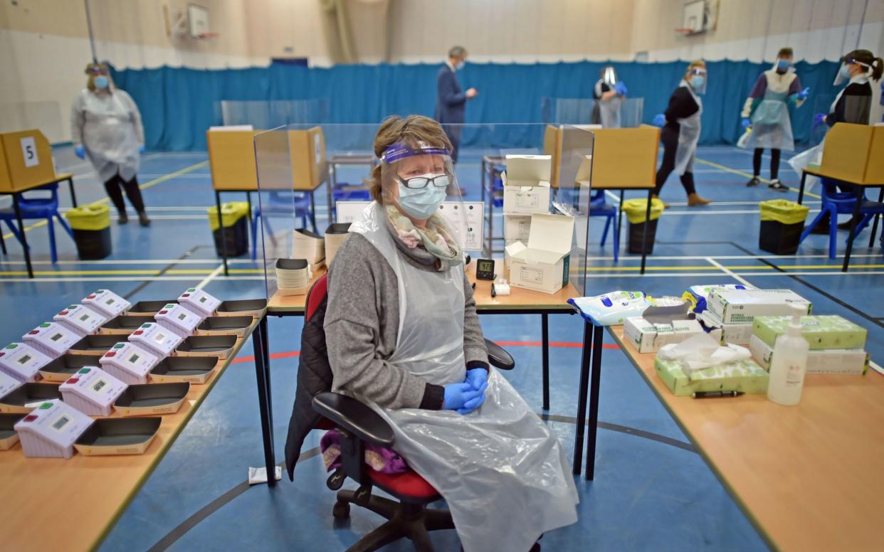 Science Technician Penny Townsend waits for lateral flow test results at Archway School in Stroud in Gloucestershire. - PA